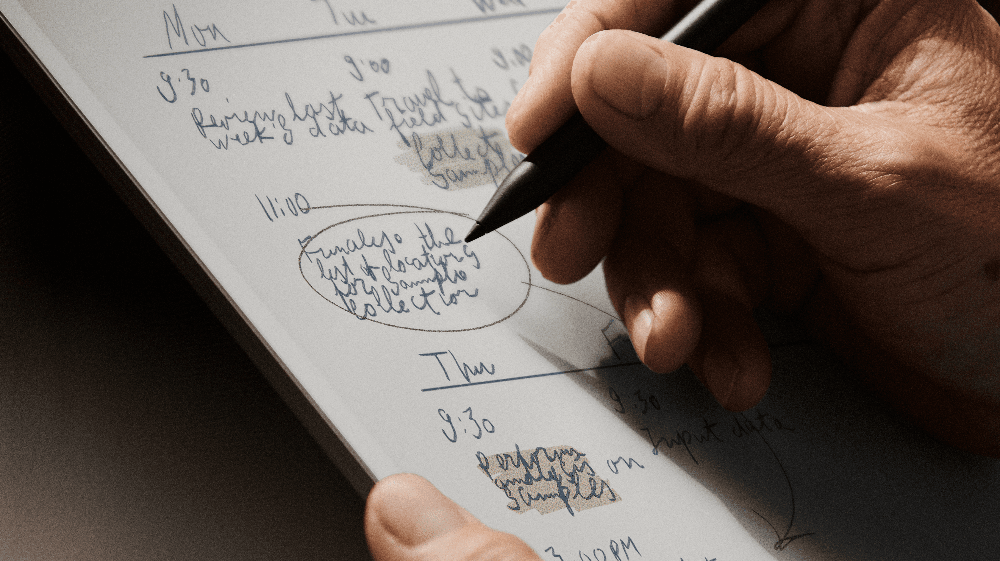 A hand writing on the reMarkable Paper Pro color display