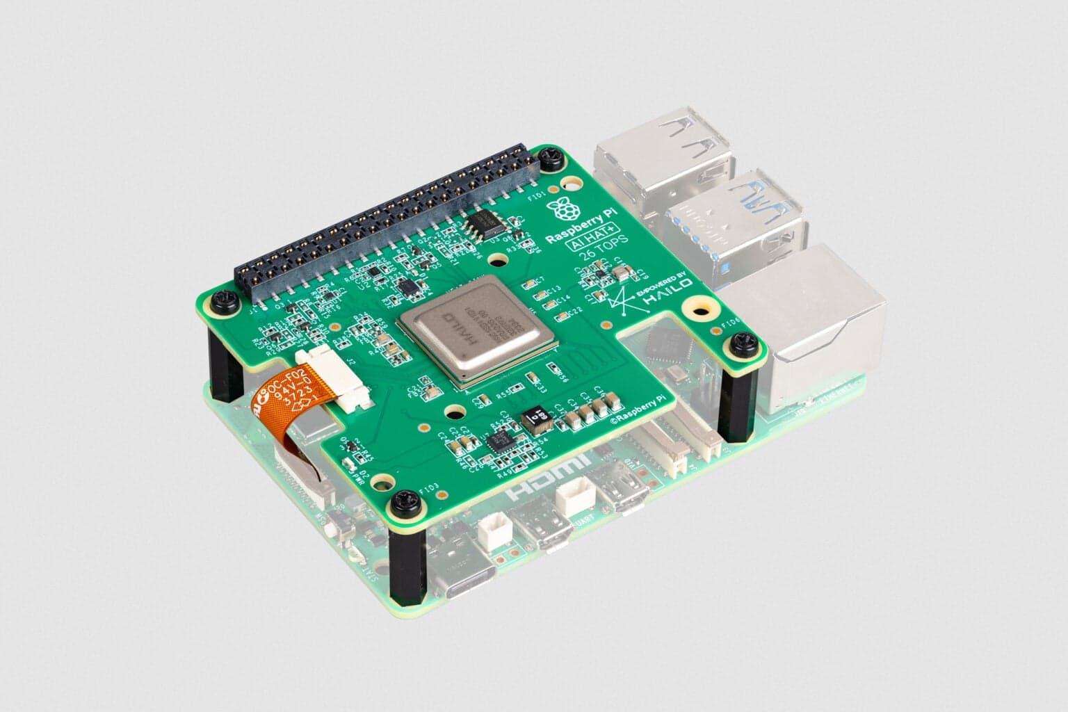 Raspberry Pi AI HAT+ 26 TOPS mounted on Raspberry Pi 5, shown outside the kit case